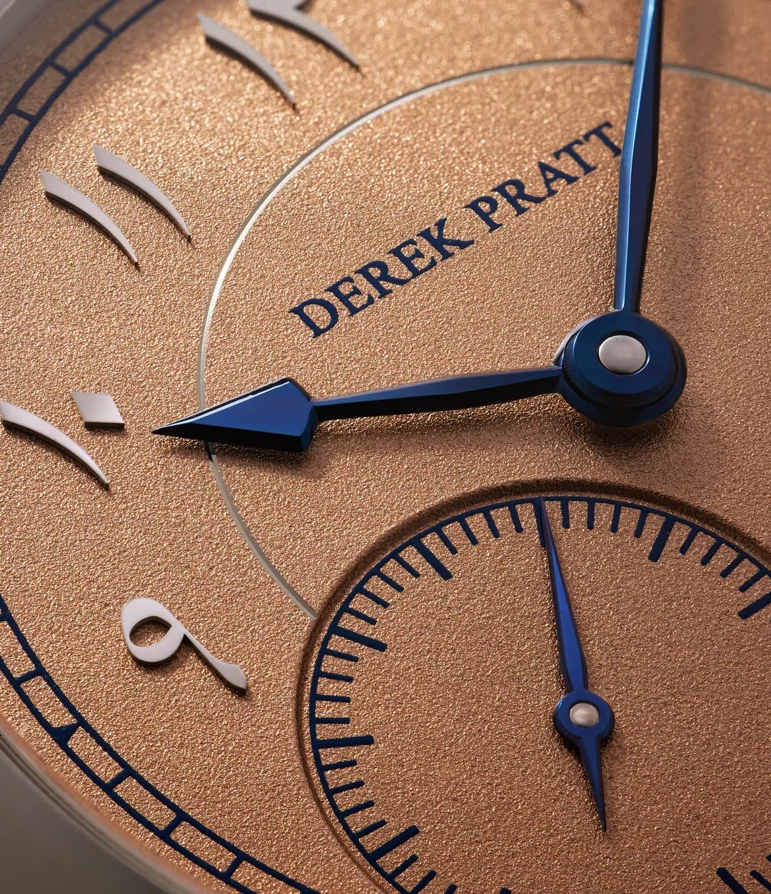 Salmon dial — close-up · Derek Pratt signature