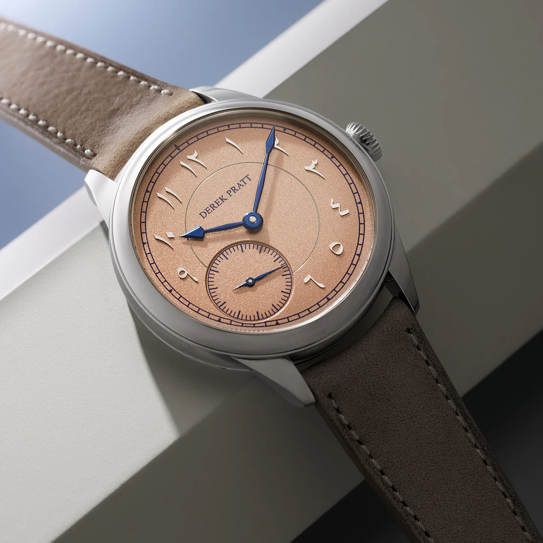 Salmon dial · Arabic numerals · tan strap